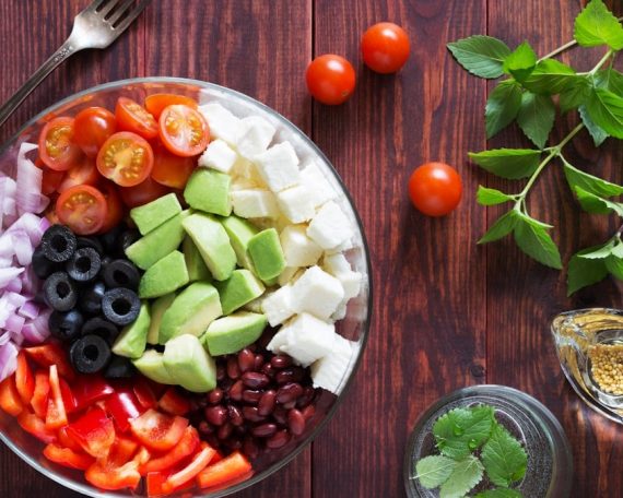 Bowl of vegetable salad with tomatoes and avocado
